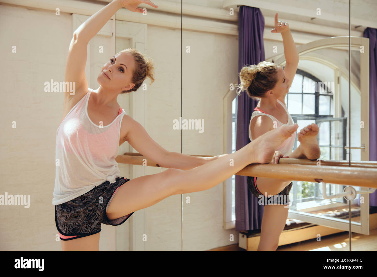 Ballet dancer training in dance studio Stock Photo