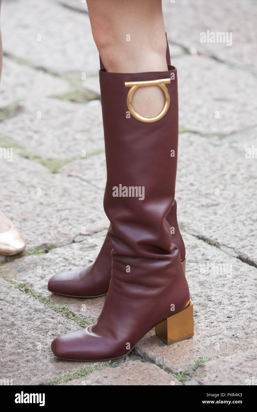 MILAN, ITALY - SEPTEMBER 22, 2018: Woman with brown leather Ferragamo boots  before Salvatore Ferragamo fashion show, Milan Fashion Week street style  Stock Photo - Alamy