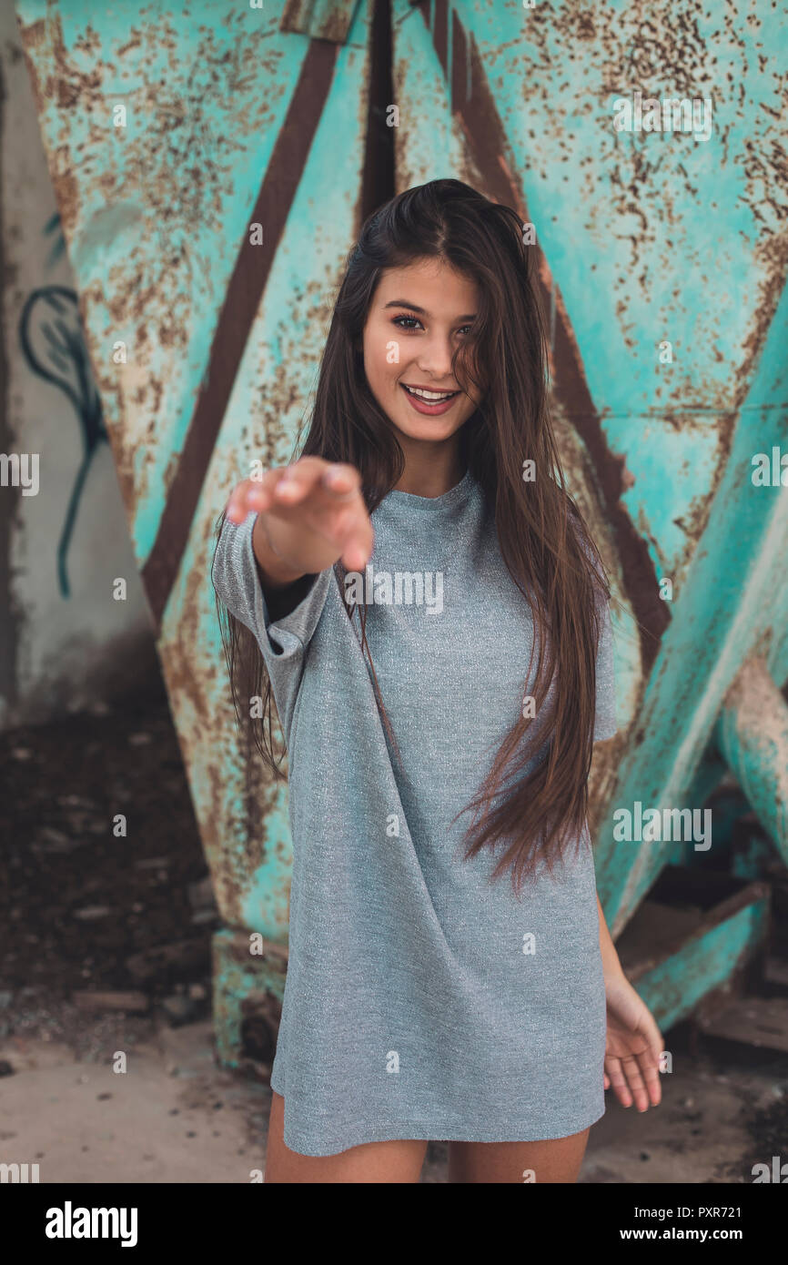 Portrait of a smiling teenager girl with long brown hair Stock Photo