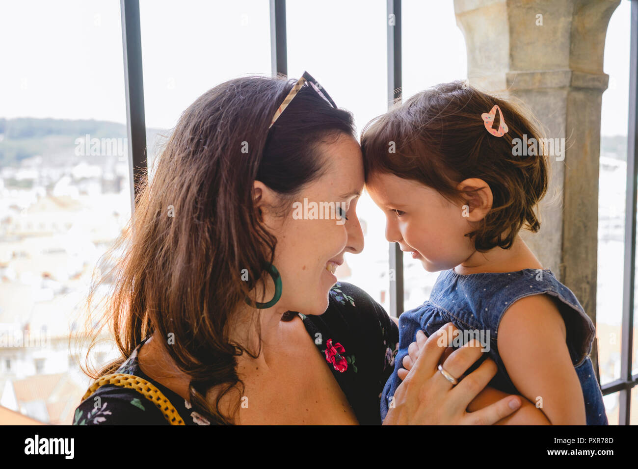 Czechia, Prague, happy mother head to head with her little daughter Stock Photo