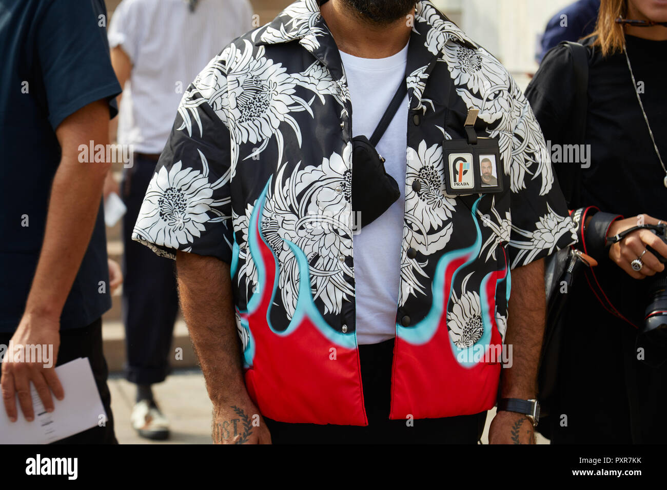 MILAN, ITALY - SEPTEMBER 22, 2018: Man with Prada jacket with floral design  in black and white and red flames before Gabriele Colangelo fashion show  Stock Photo - Alamy
