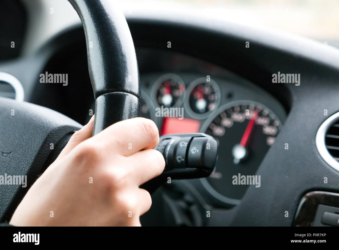 Hand on steering wheel hi-res stock photography and images - Alamy