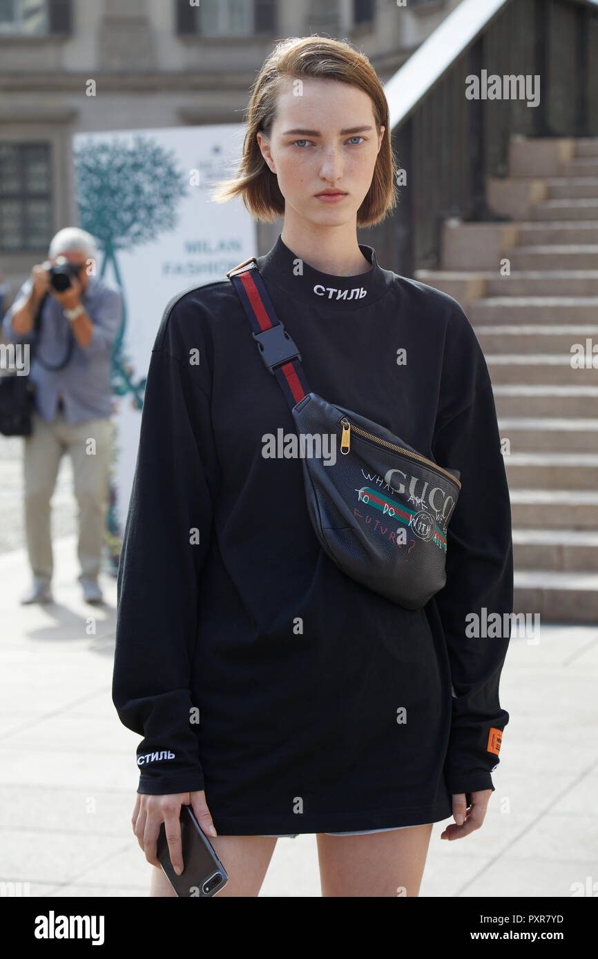 Woman with black Gucci t-shirt and Louis Vuitton bag before Prada fashion  show, Milan Fashion Week street style on June 18, 2017 in Milan. – Stock  Editorial Photo © AndreaA. #273670452