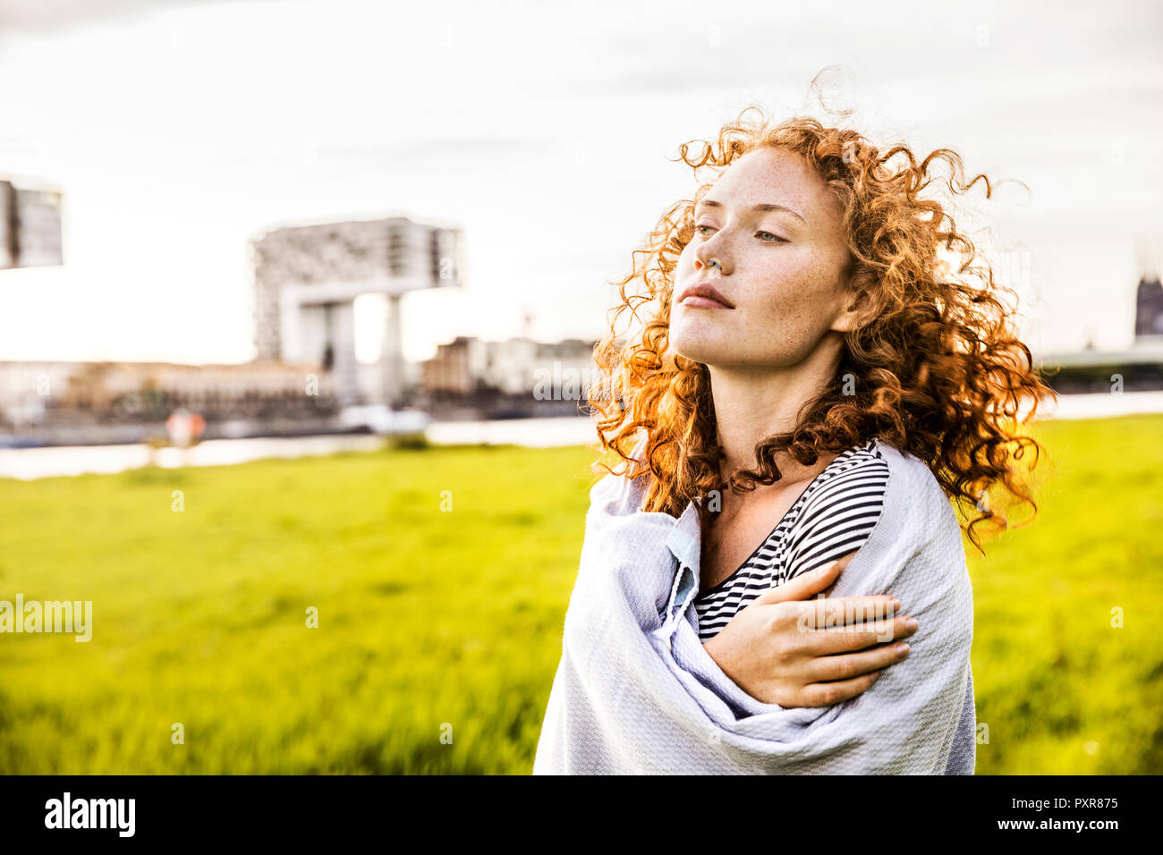 Germany, Cologne, portrait of pensive young woman Stock Photo