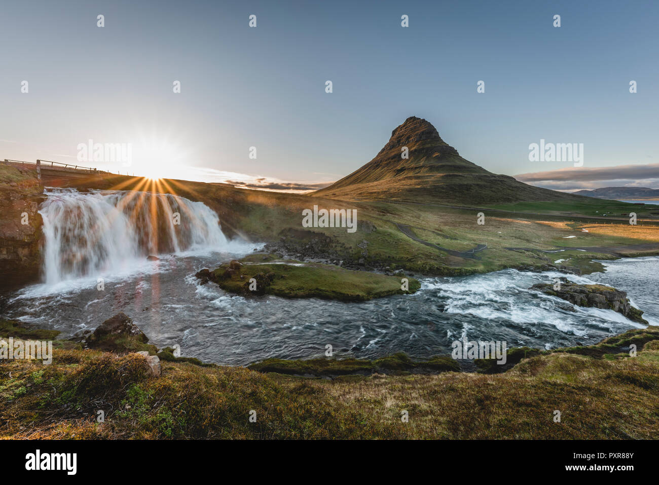 Iceland, Snaefellsnes, Kirkjufell, Kirkjufellsfoss waterfall at sunset Stock Photo