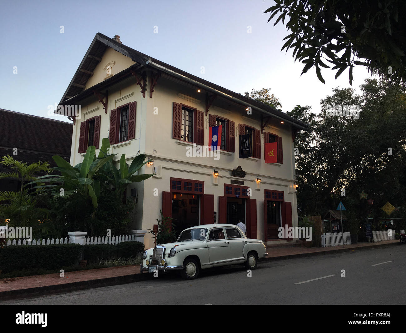 Rolls Royce in front of colonial structure in Luang Prabang, Laos Stock Photo