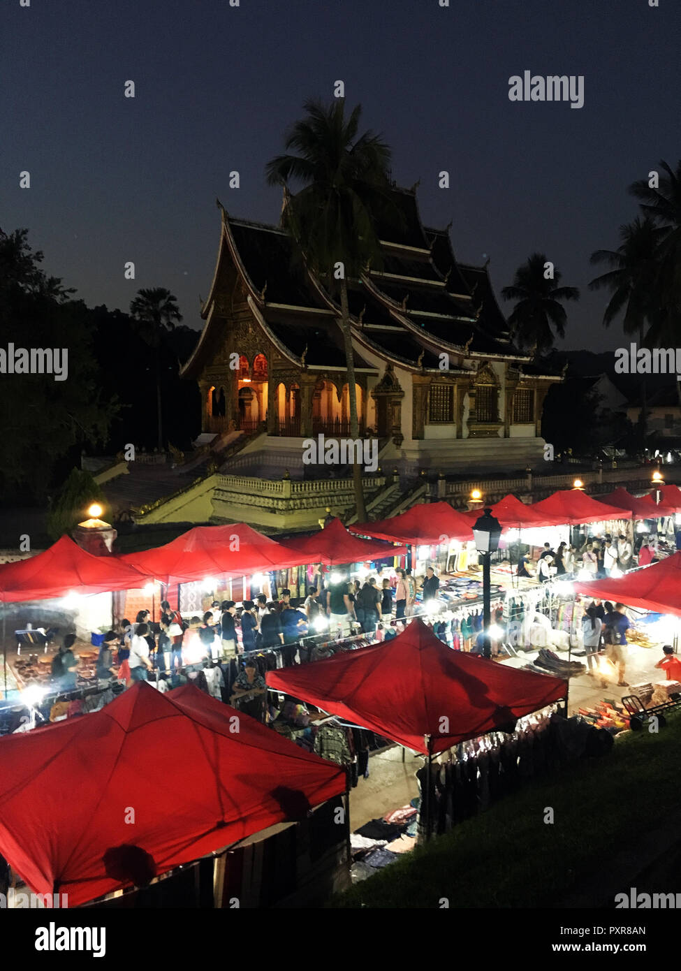 Night market in front of Haw Pha Bang temple in Luang Prabang, Laos Stock Photo