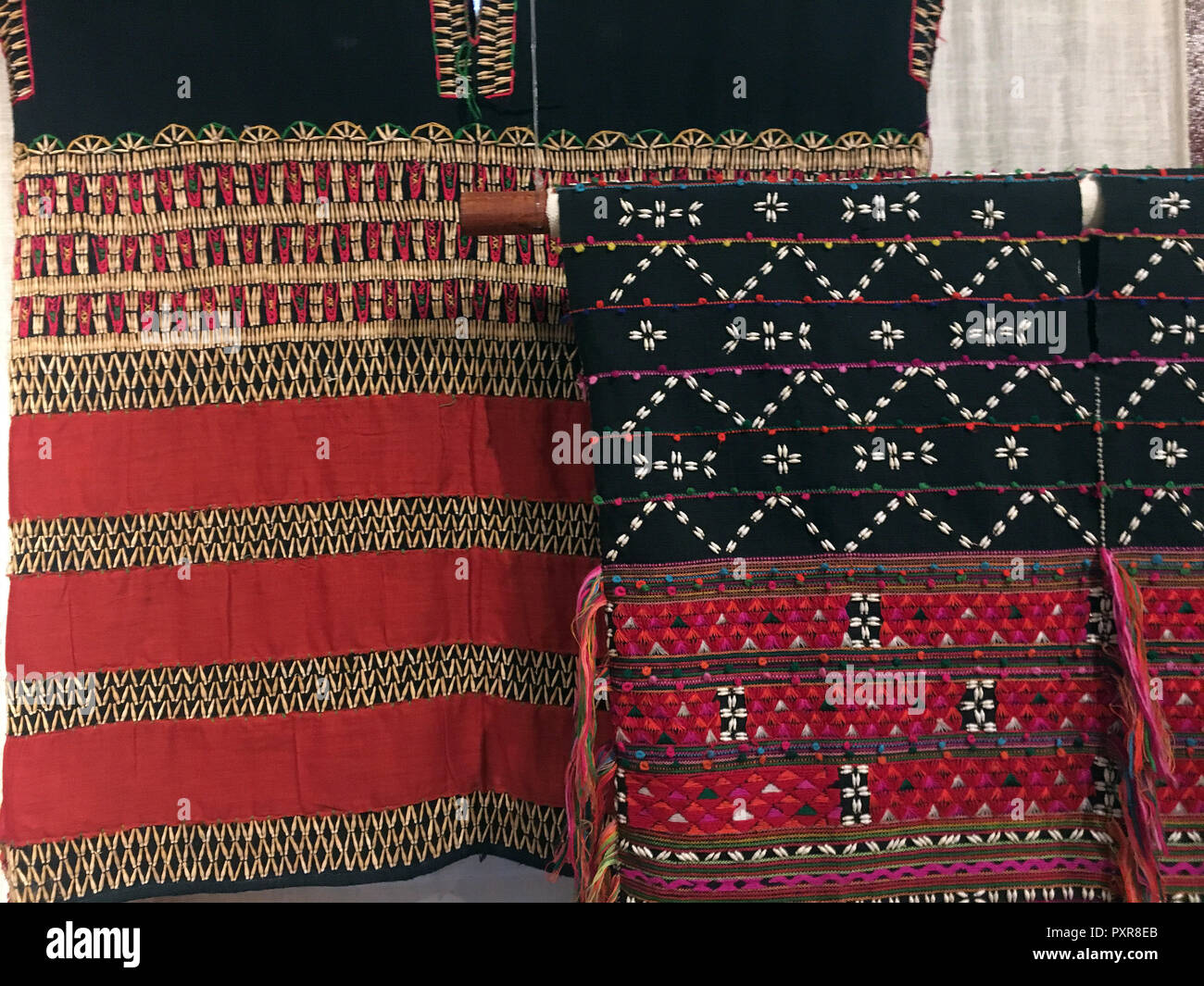 Beaded, embroidered garments on display in Luang Prabang, Laos Stock Photo