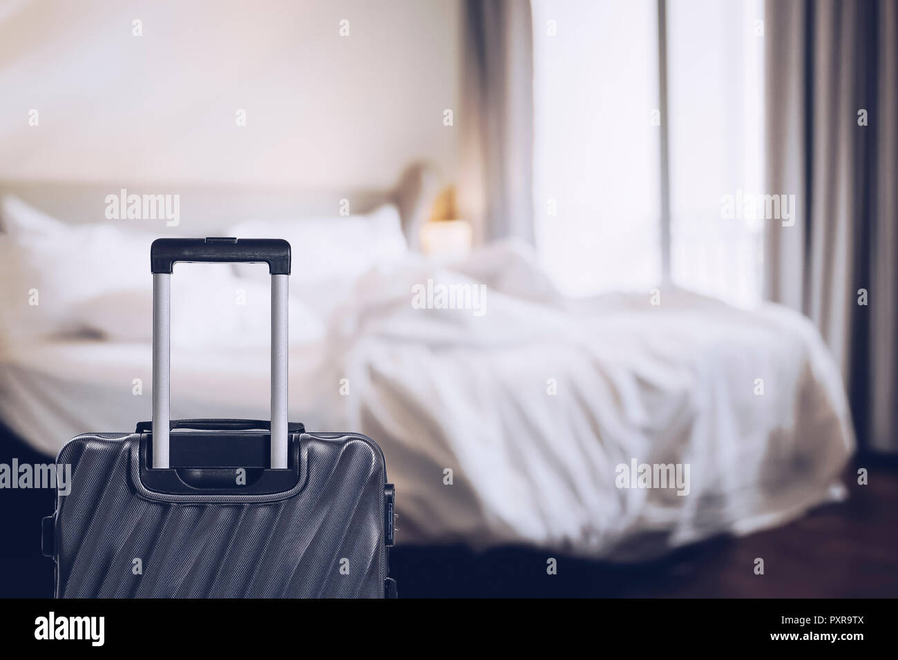 Suitcase or Luggage bag in a modern hotel room prior to checkin or
