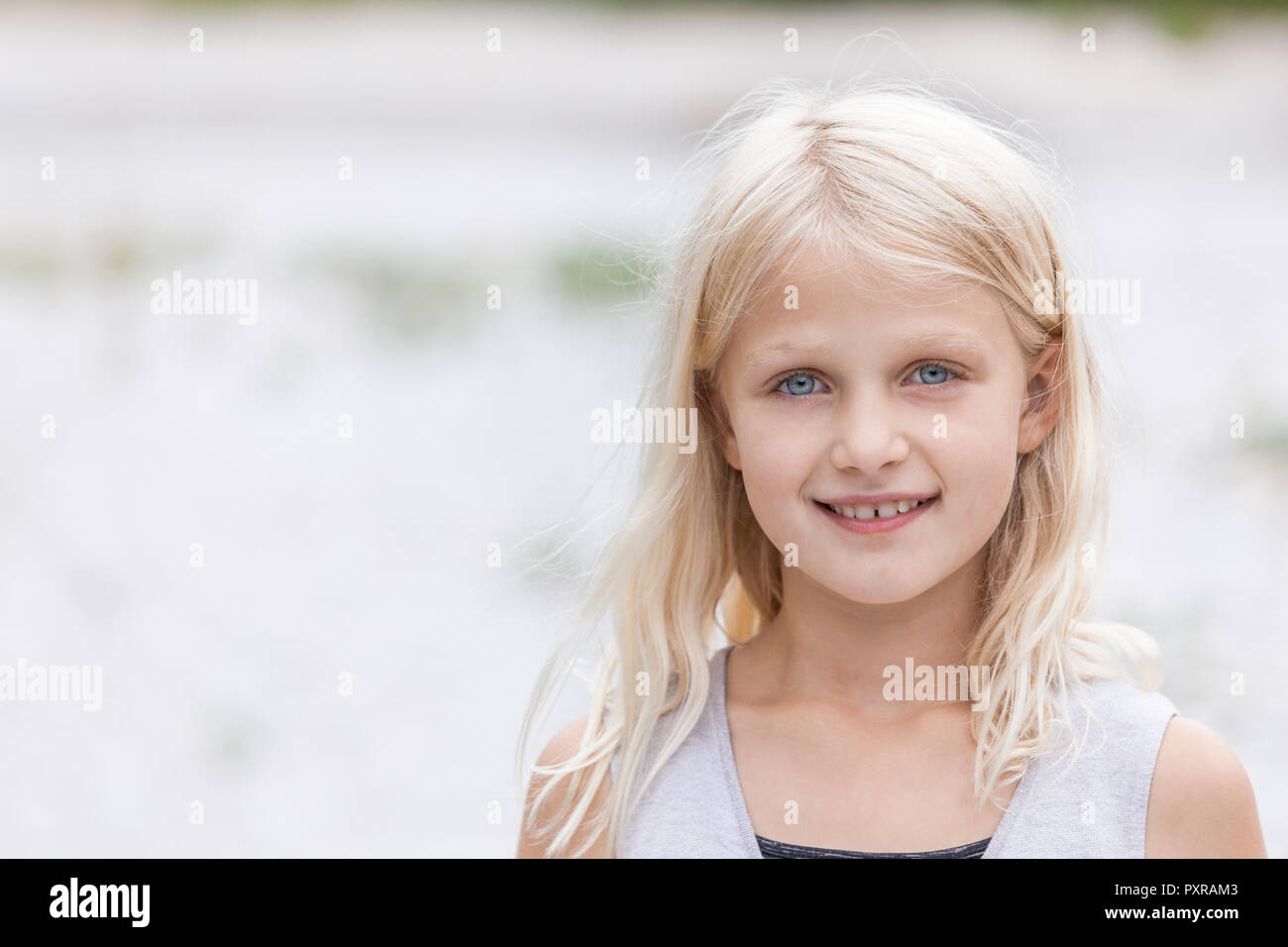 Portrait of smiling girl outdoors Stock Photo - Alamy