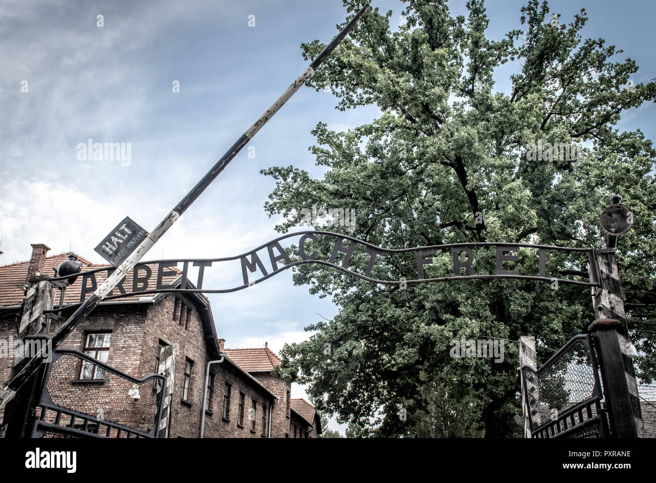 Infamous 'Arbeit Macht Frei' or 'Work Sets You Free' inscription over the front gate entrance of Auscwitz-Birkenau concentration camp, Oswiecim, Lesse Stock Photo