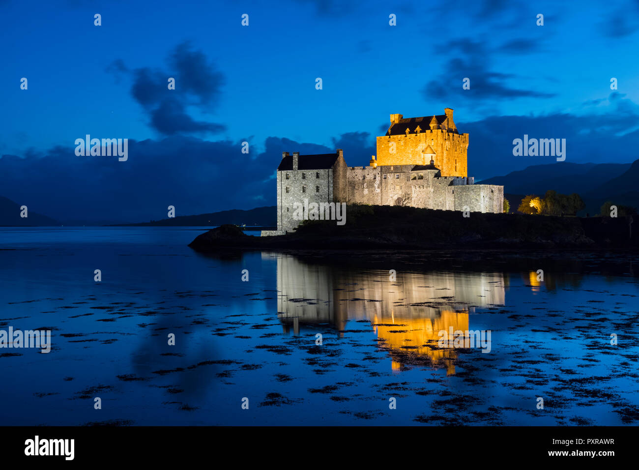 UK, Scotland, Dornie, Loch Duich, Eilean Donan Castle at blue hour Stock Photo