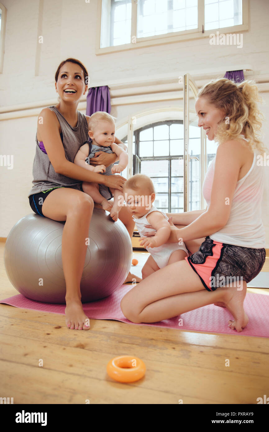 Mothers and babies in exercise room Stock Photo
