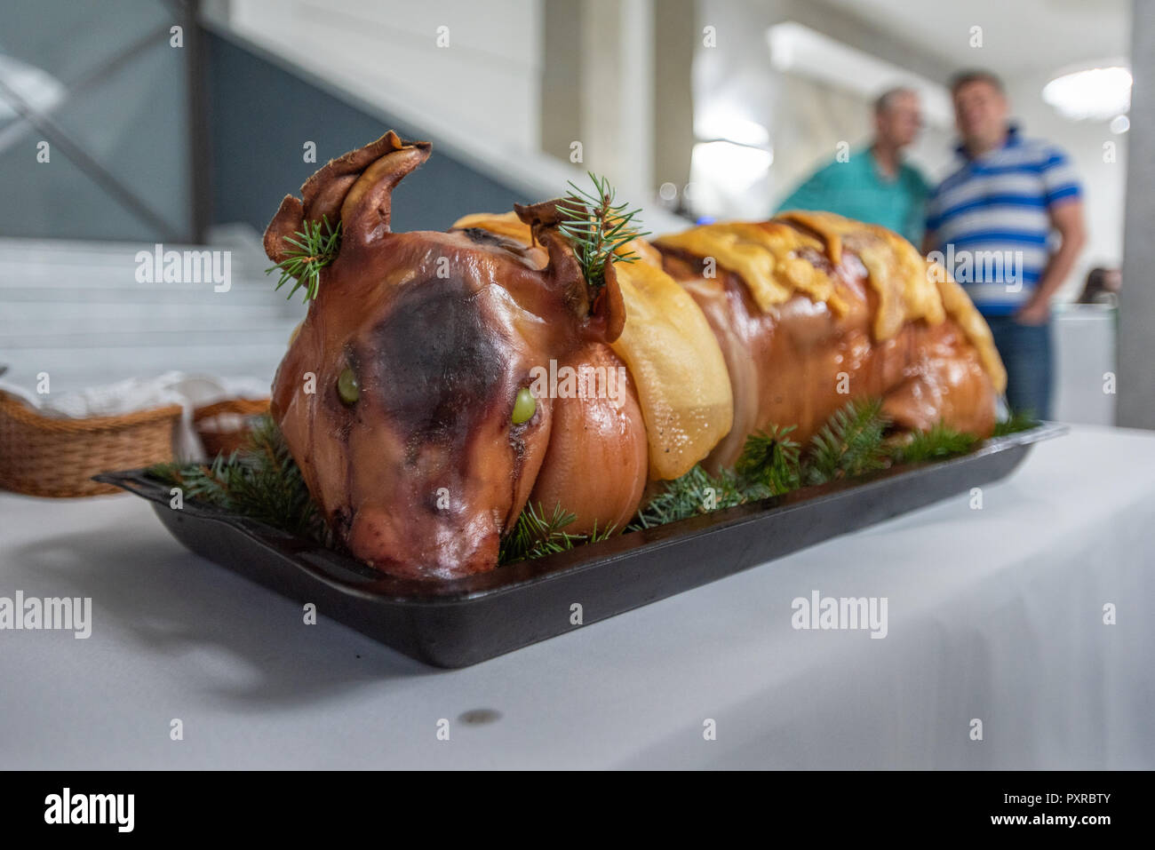 Whole roasted pig garnished with grapes and pine leaves for Polish banquet, Masovian Voivodeship, Poland Stock Photo