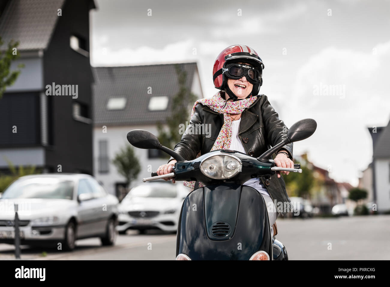 Old lady on scooter hires stock photography and images Alamy