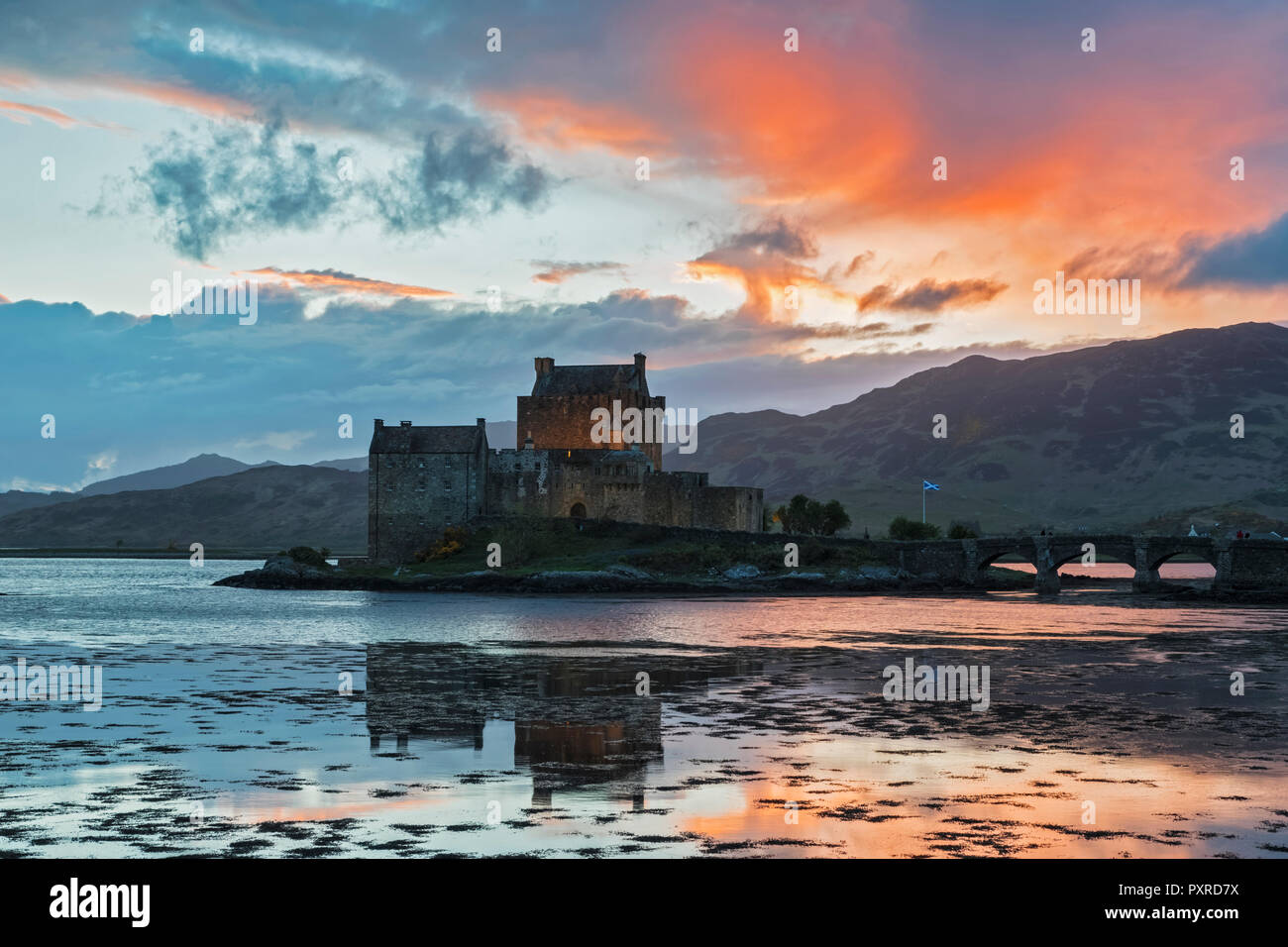 UK, Scotland, Dornie, Loch Duich, Eilean Donan Castle at sunset Stock Photo