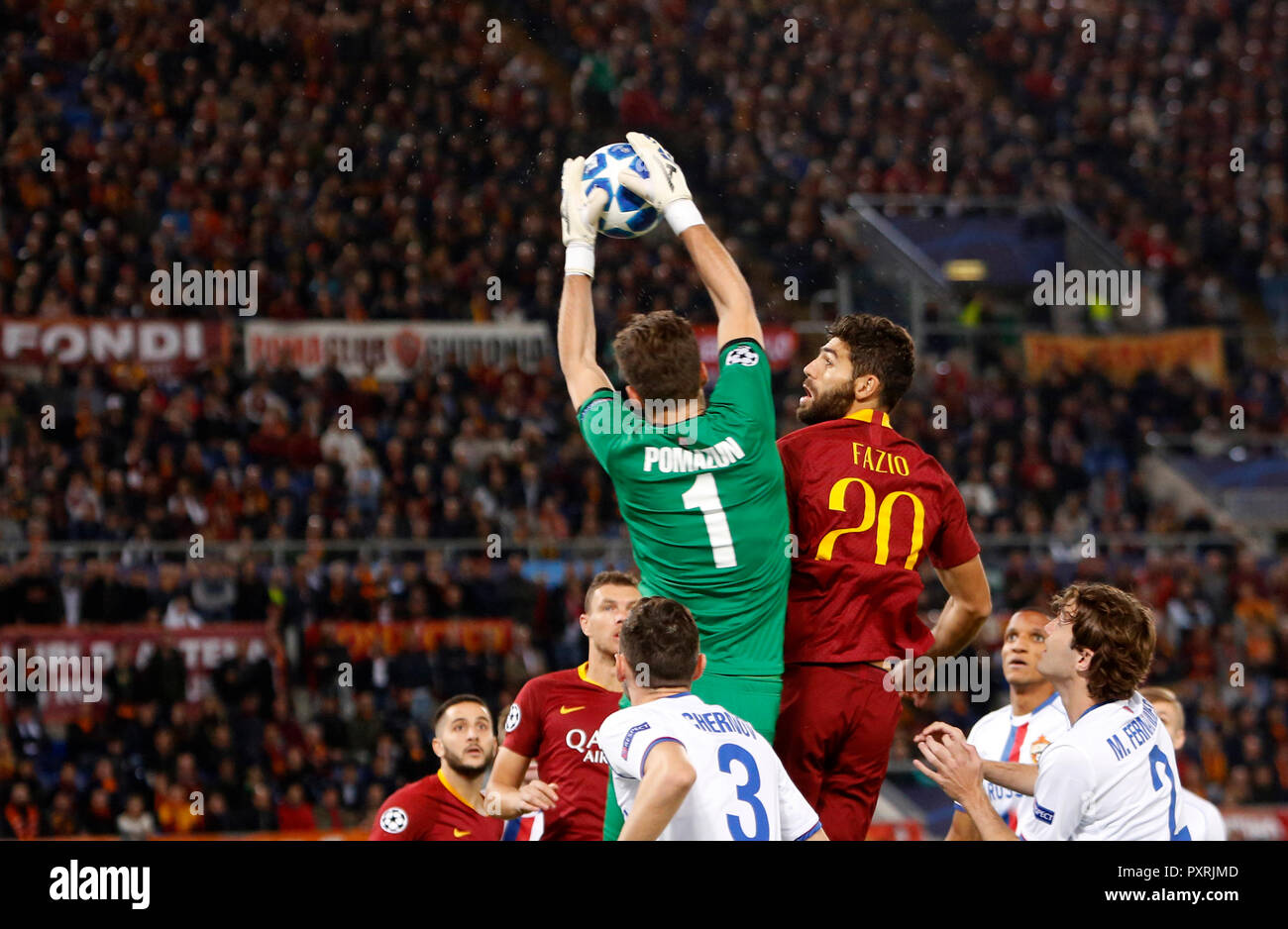 Rome, Italy, 23rd October, 2018. CSKA Moscow's goalkeeper Ilya Pomazun, top left, grabs the ball past Roma's Federico Fazio during the Champions League Group G soccer match between Roma and CSKA Moscow at the Olympic Stadium. Roma won 3-0. © Riccardo De Luca UPDATE IMAGES/ Alamy Live News Stock Photo