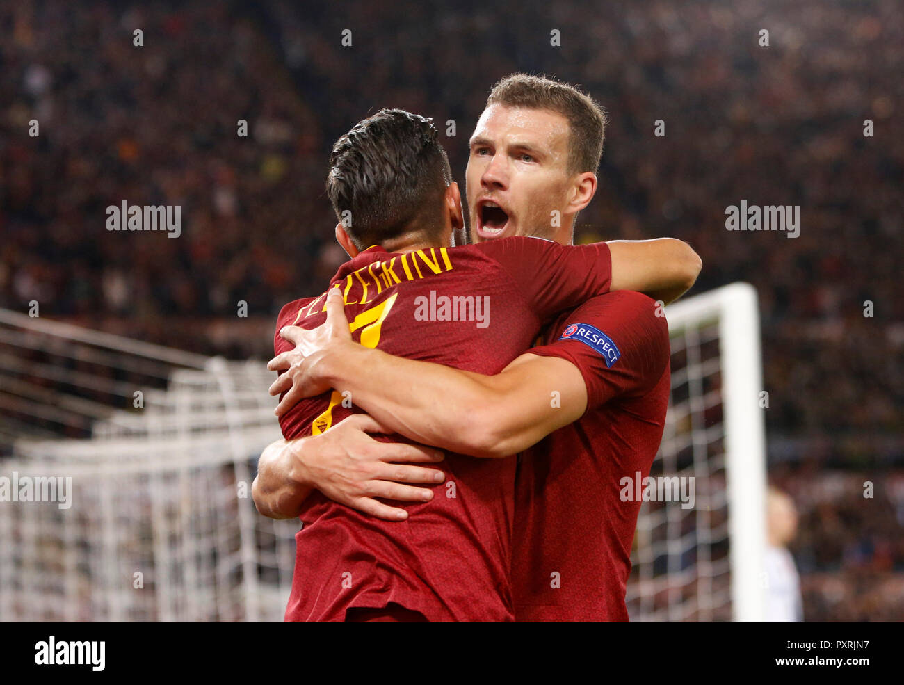 Rome, Italy, 23rd October, 2018. Roma's Edin Dzeko, right, celebrates with his teammate Lorenzo Pellegrini after scoring during the Champions League Group G soccer match between Roma and CSKA Moscow at the Olympic Stadium. Roma won 3-0. © Riccardo De Luca UPDATE IMAGES/ Alamy Live News Stock Photo