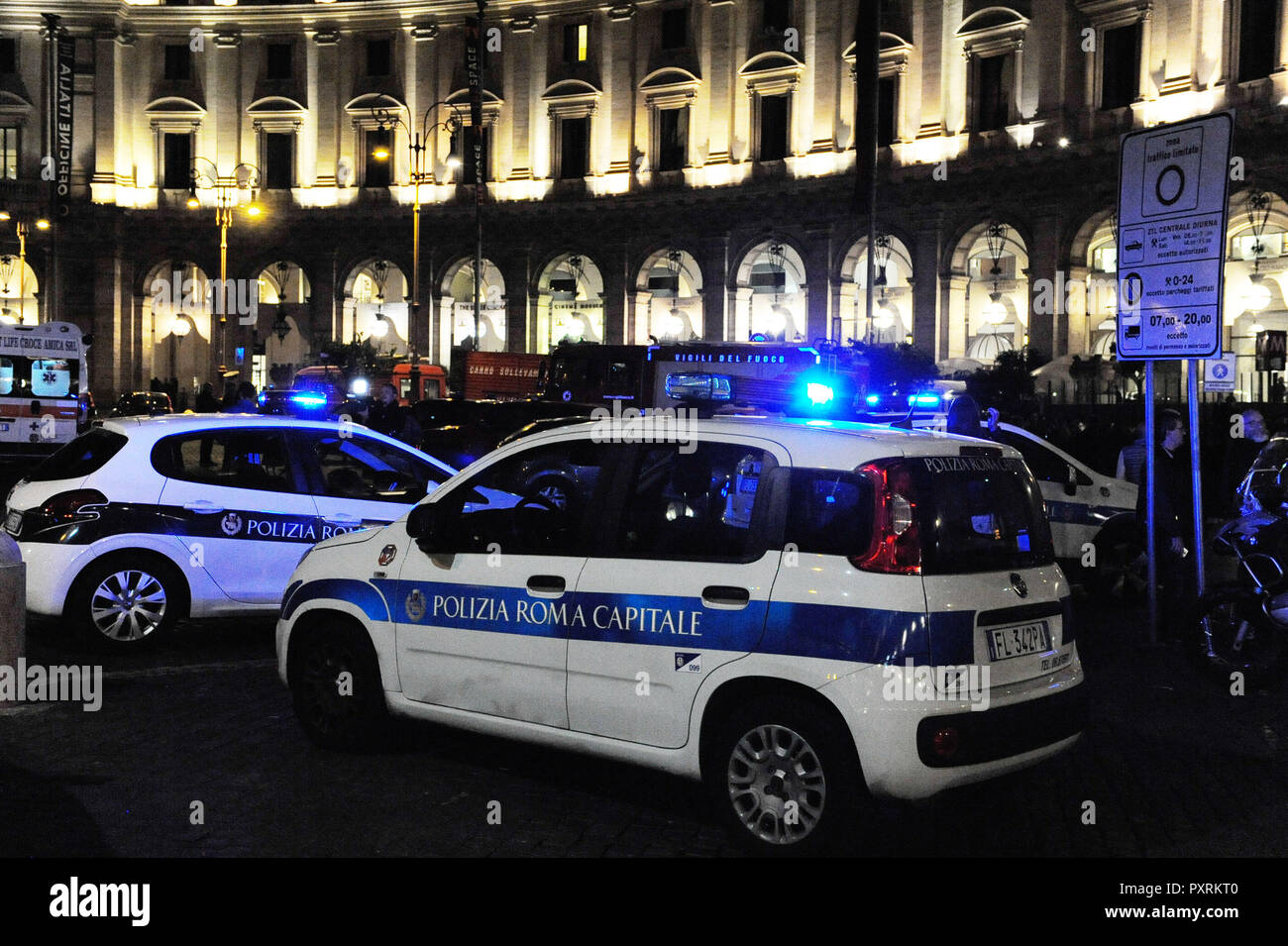 Rome, Italy. 23rd Oct, 2018. Police cars are seen outside the metro station where an escalator collapsed in Rome, Italy, on Oct. 23, 2018. At least 20 Russian football fans were injured when an escalator at a busy Rome metro station collapsed on Tuesday night, local media reported. Credit: Chen Zhanjie/Xinhua/Alamy Live News Stock Photo