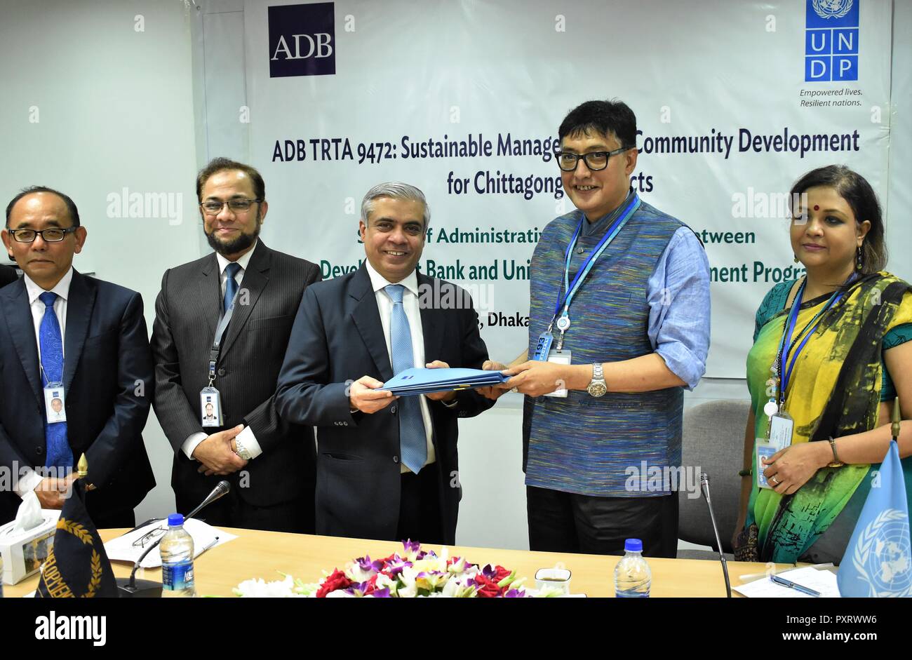 Dhaka. 23rd Oct, 2018. Photo taken on Oct. 23, 2018 shows the signing ceremony of an administrative arrangement between the Asian Development Bank (ADB) and the UN Development Program(UNDP) in Dhaka, capital of Bangladesh. ADB and UNDP signed an administrative arrangement Tuesday to promote sustainable management of community development in the Chattogram Hill Tracts (CHT) in the southern part of Bangladesh. Credit: Jibon Ahsan/Xinhua/Alamy Live News Stock Photo