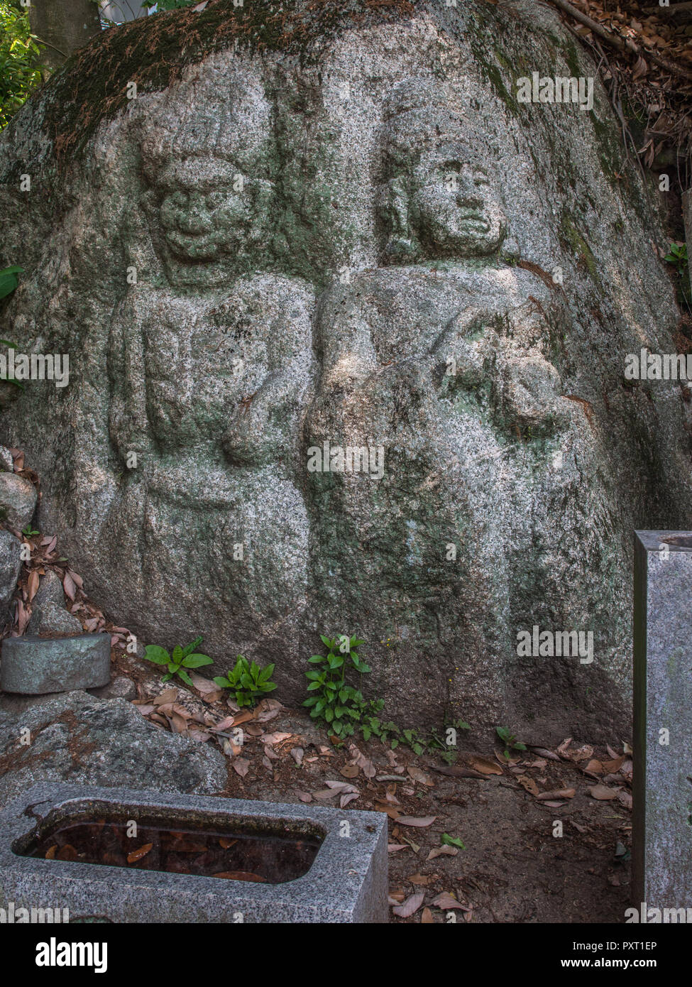 Roadside shrine, Fudo Myo-o image carved into rock, Sanuki, Kagawa, Shikoku, Japan Stock Photo