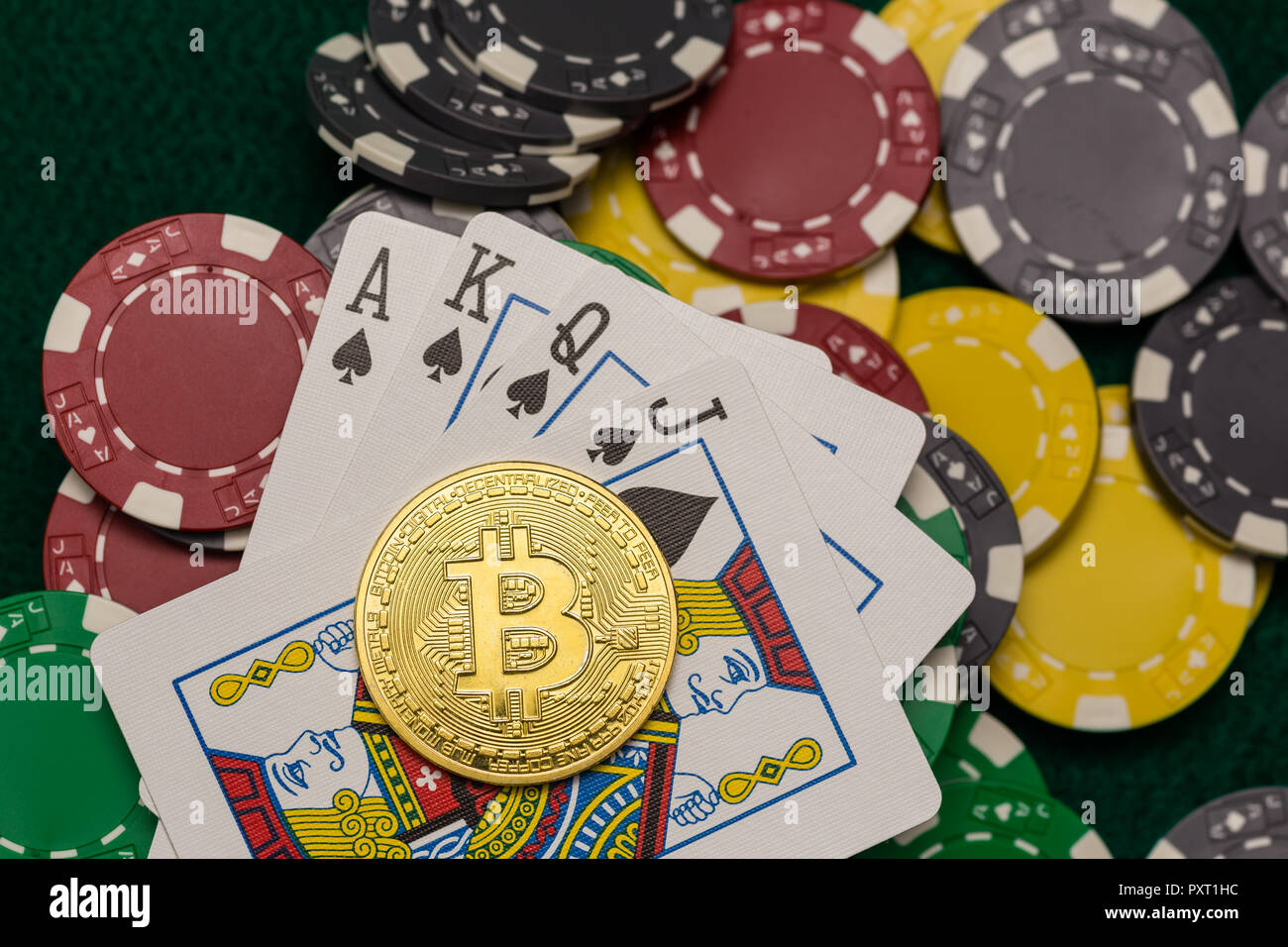 Bitcoin gold coin with poker chips on a green poker table against black  background. Blockchain casino. Online gambling Stock Photo - Alamy