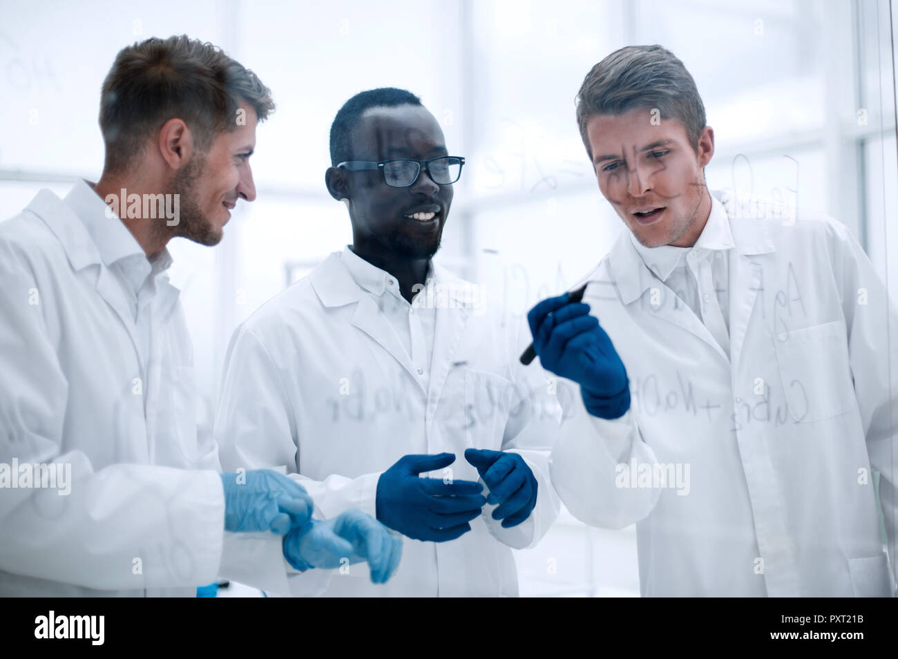 promising scientist makes notes on the Board Stock Photo