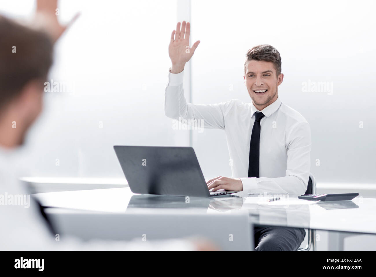 two businessmen greet each other from the workplace Stock Photo - Alamy