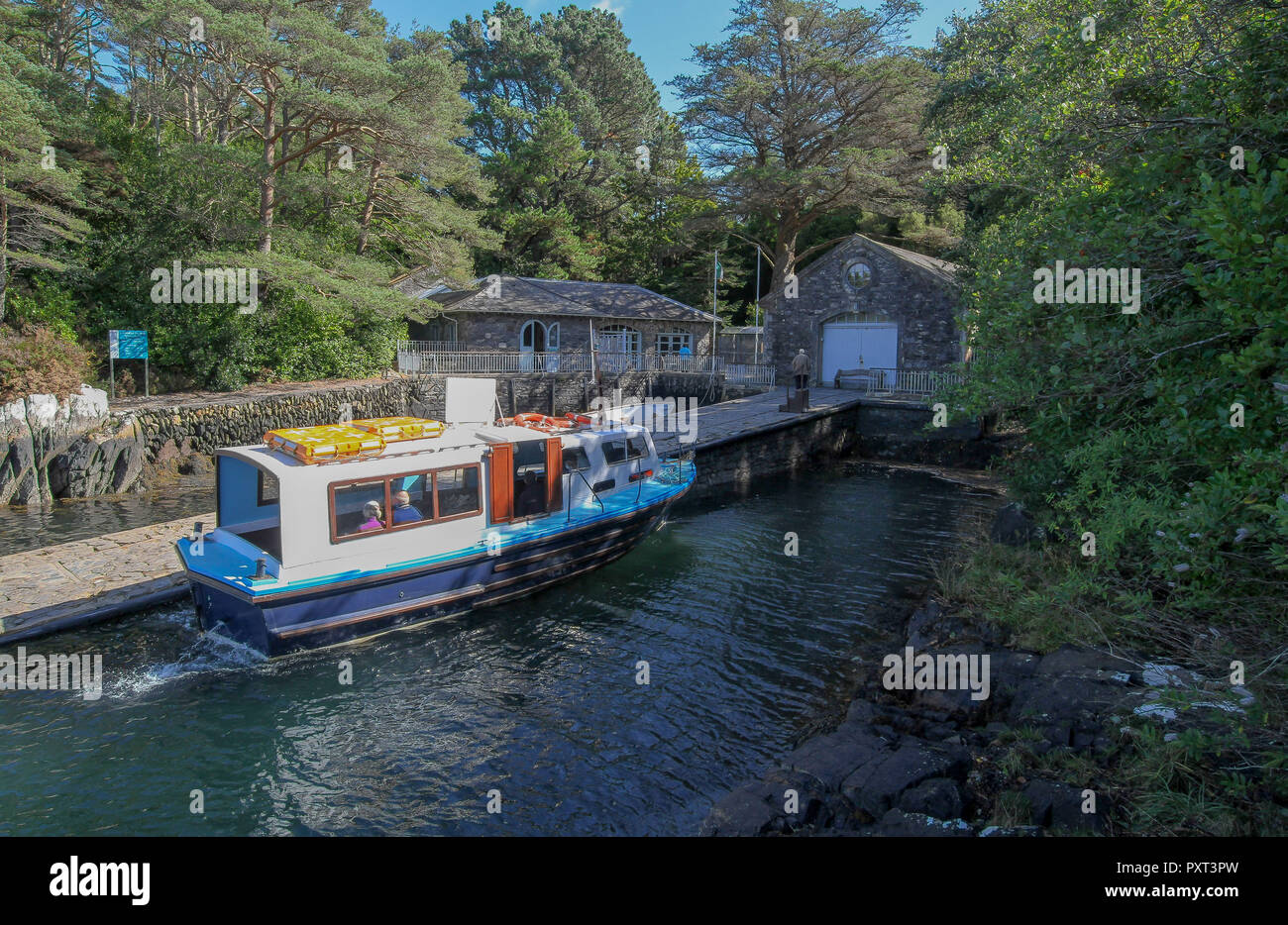 Small passenger ferry service Ireland - the ferry and passengers at Garnish Island, Bantry Bay, County Cork, Ireland. Stock Photo