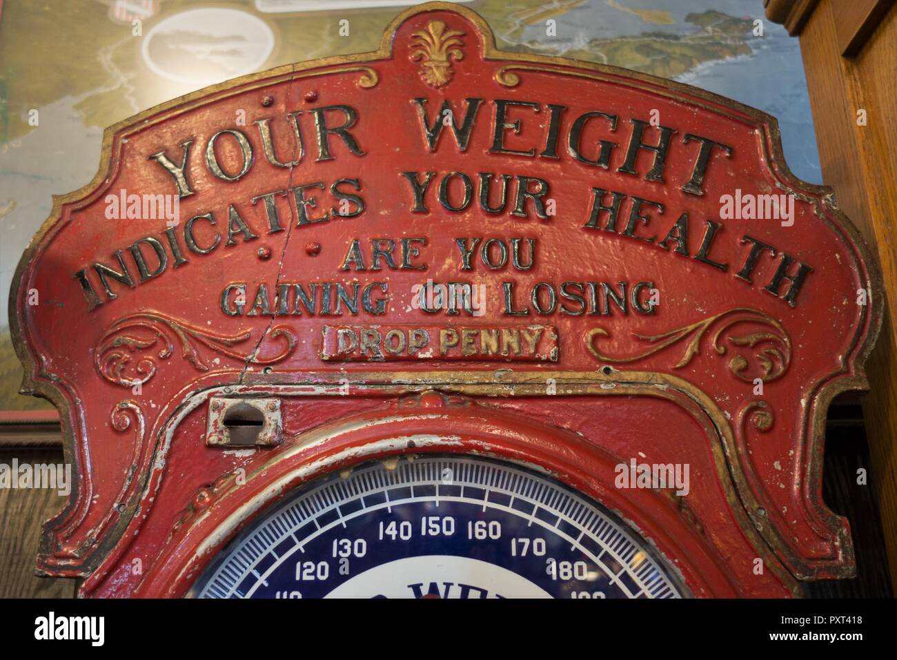 Antique coin operated scale at Marsh's Free Museum in Long Beach, Washington, USA. Stock Photo