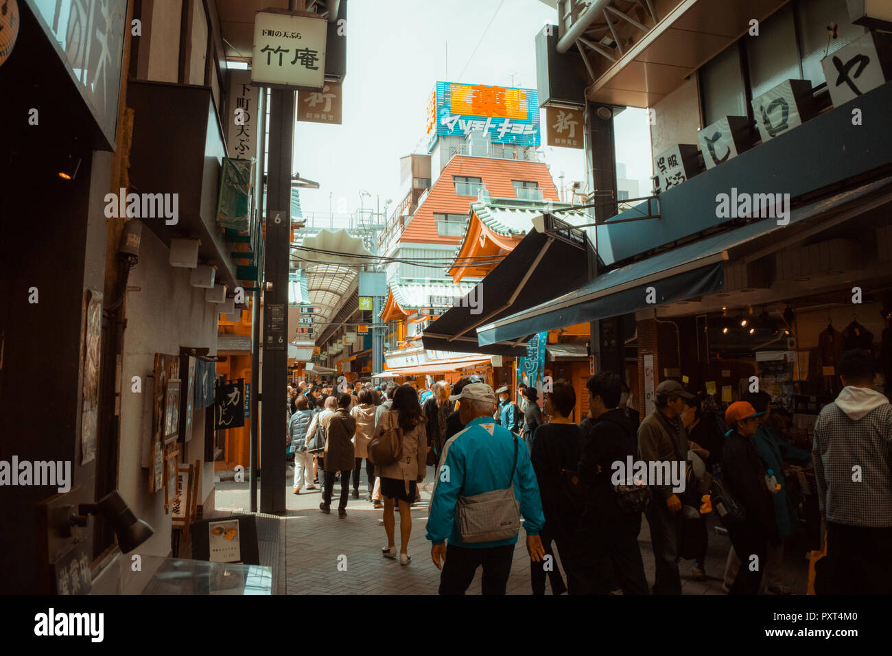 Japan streeet photography. Alley with shops, locals and tourists. Stock Photo