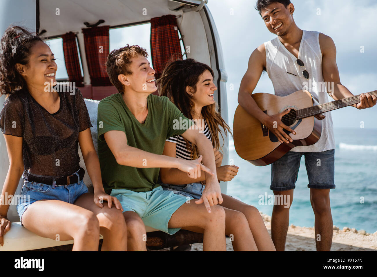 Hipster friends enjoying time at the beach Stock Photo