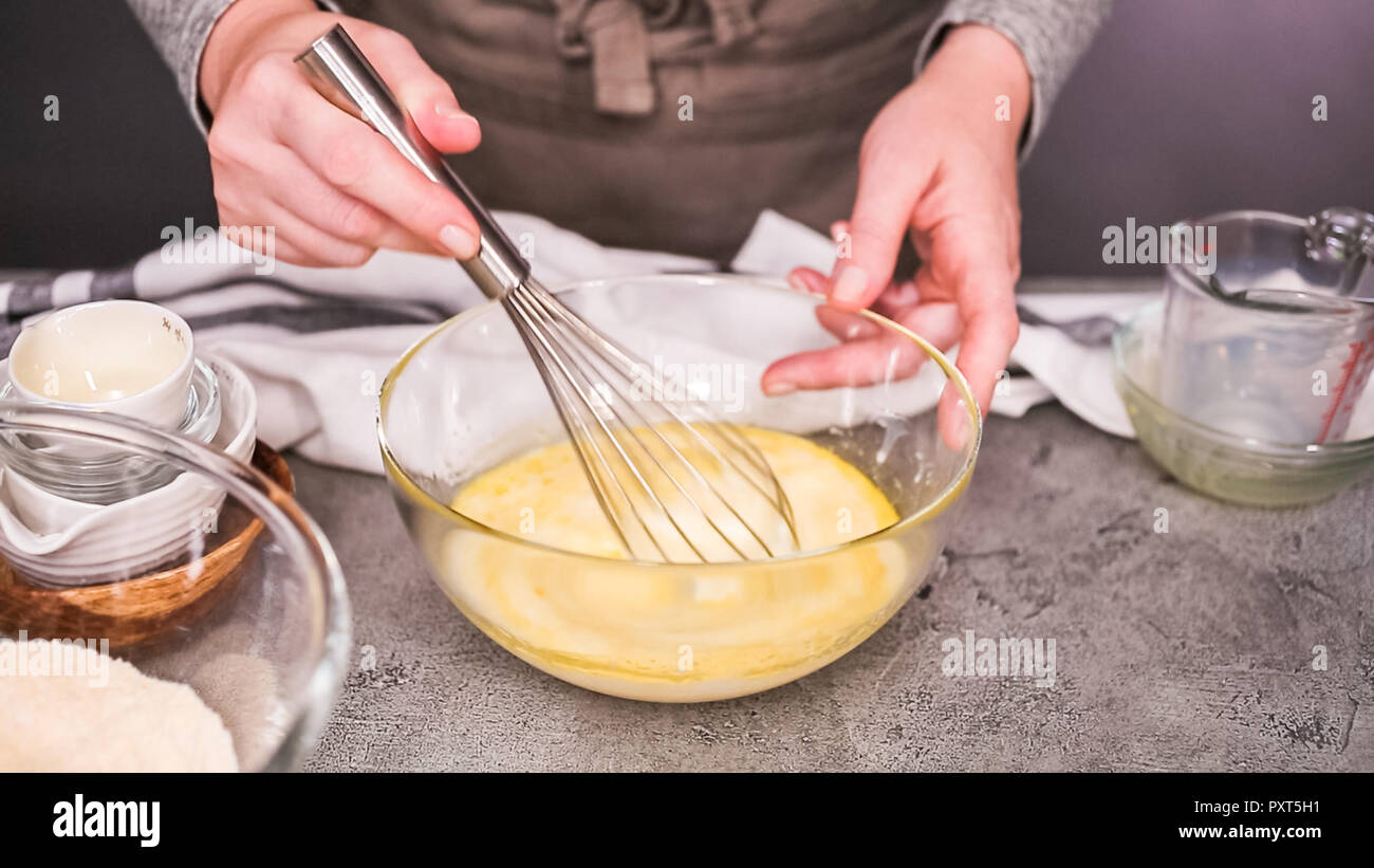 Mixing Ingredients Example Step by step. Mixing ingredients together in glass mixing bowl for ...