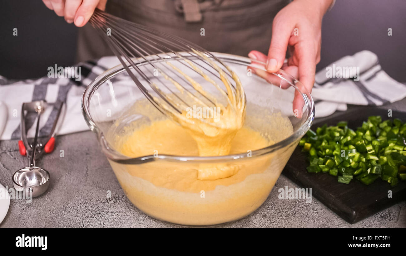 Mixing Ingredients Example Step by step. Mixing ingredients together in glass mixing bowl for ...
