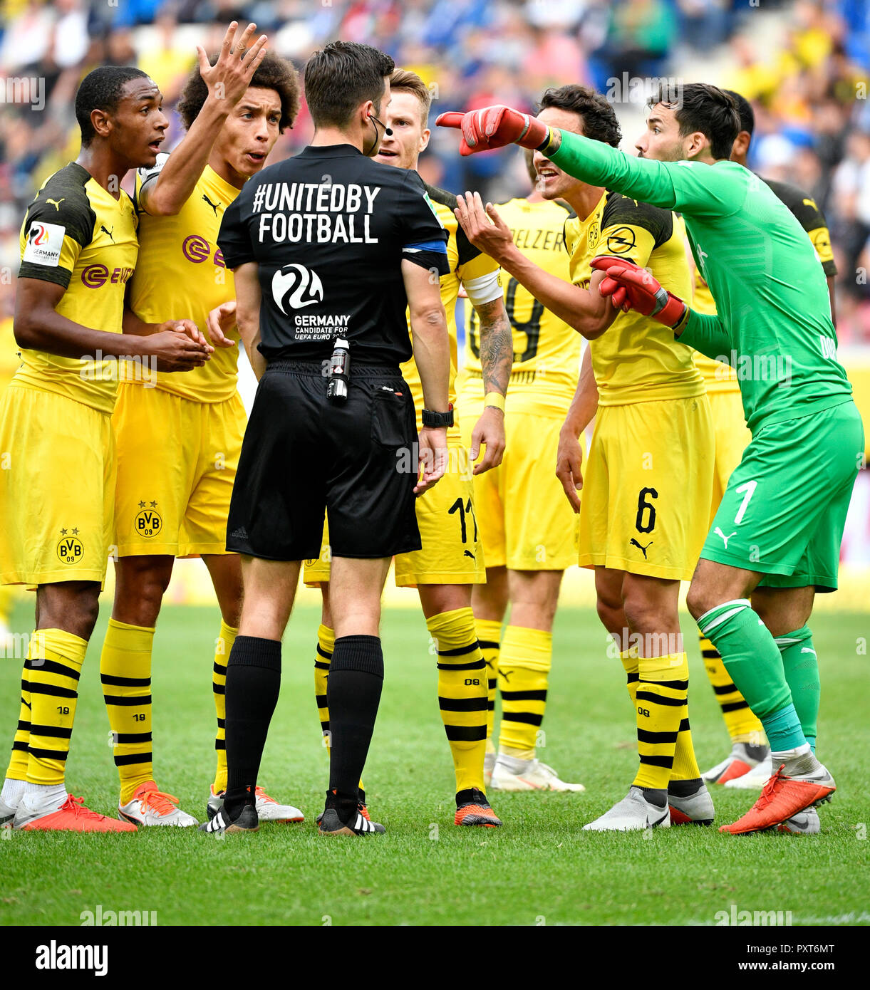 Referee Referee Harm Osmers discusses with players Borussia Dortmund 09 BVB, from left Abou Diallo, Axel Witsel, Marco Reus Stock Photo