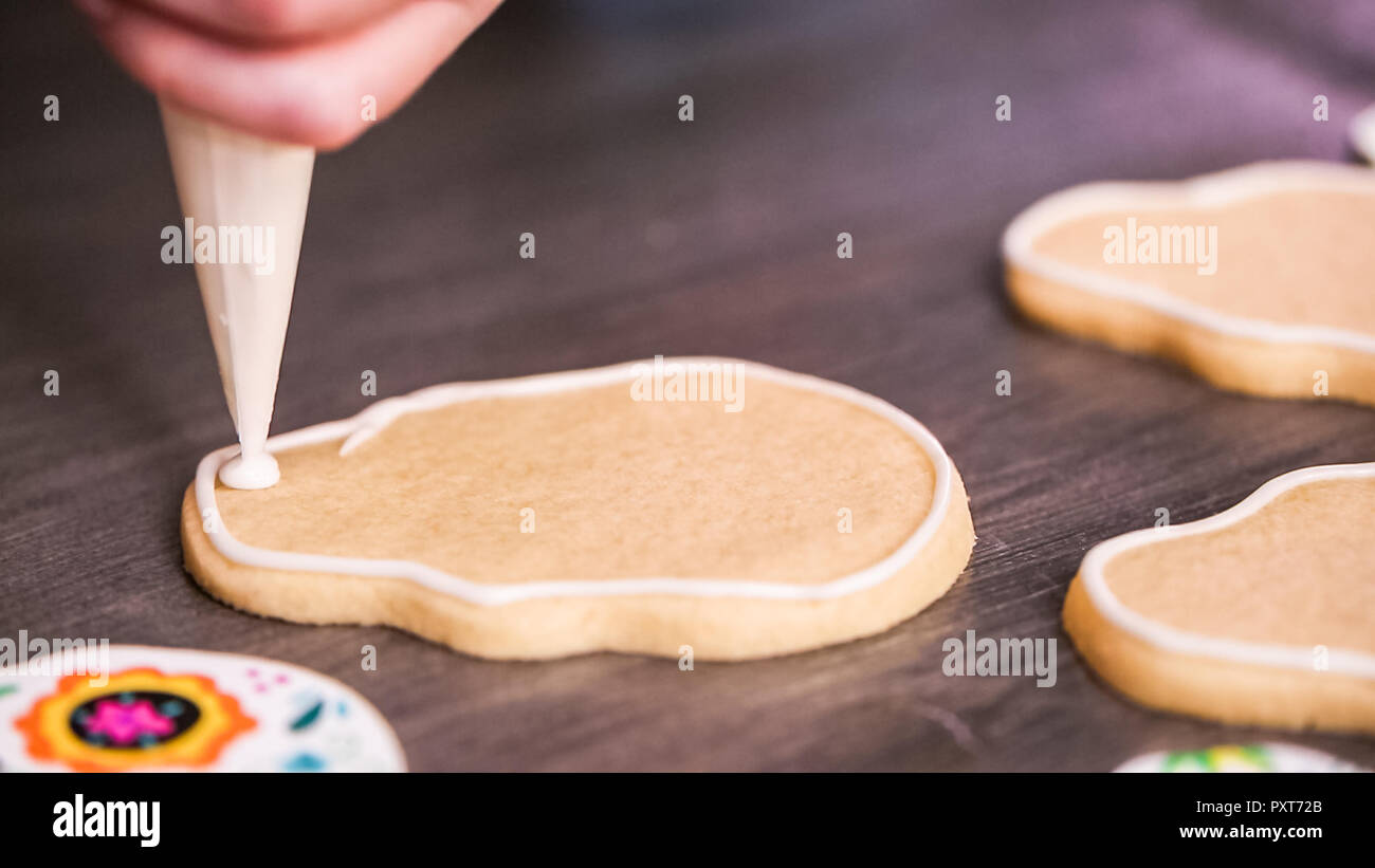 Step by step. Creating edge for flooding sugar skull cookie with royal