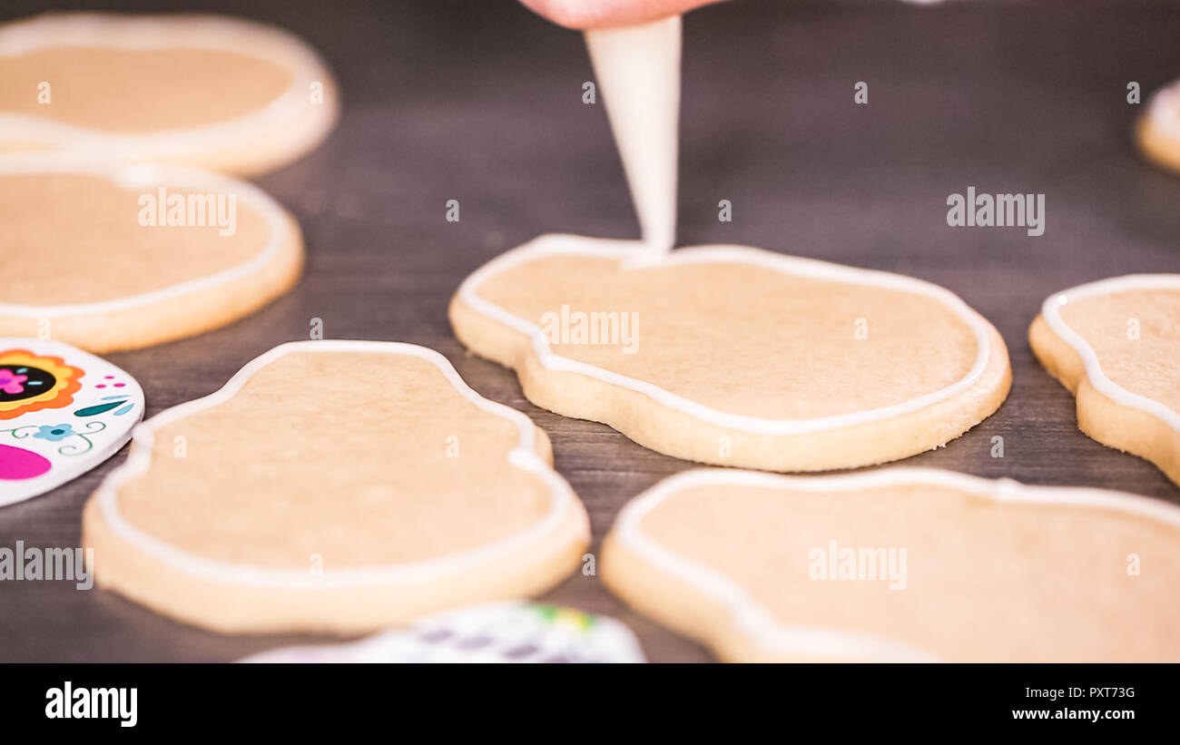 Step by step. Creating edge for flooding sugar skull cookie with royal