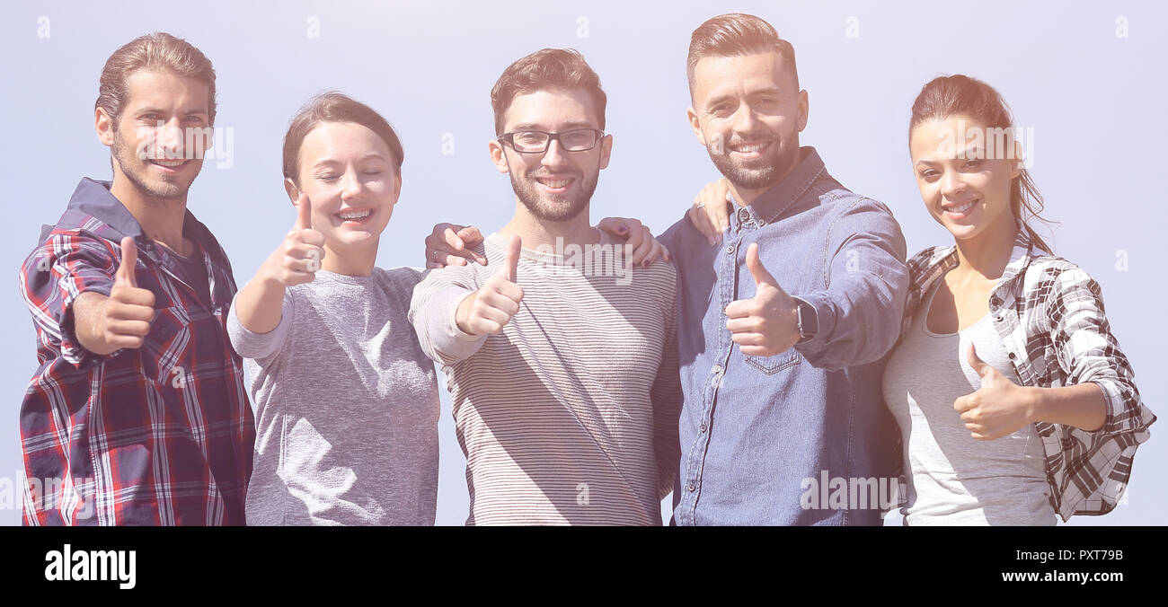 group of young people showing thumb up Stock Photo - Alamy