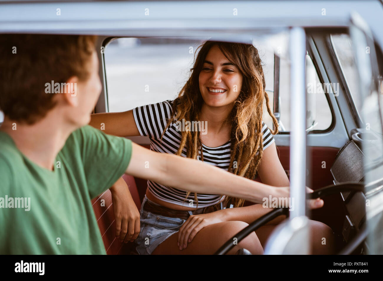 Side view of young couple inside car Stock Photo