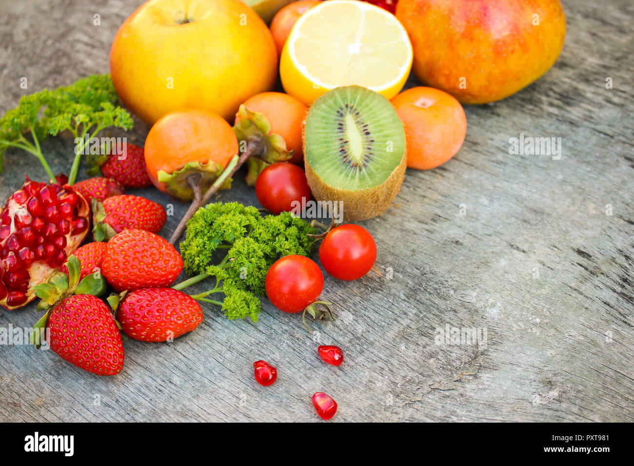 Fruits, vegetables on wooden background Stock Photo