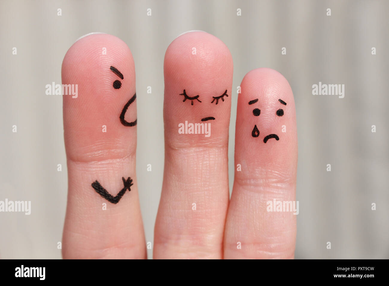 Finger art of a family during an argument. The concept of a man scolds his wife and child, a woman is sad, the baby is crying Stock Photo
