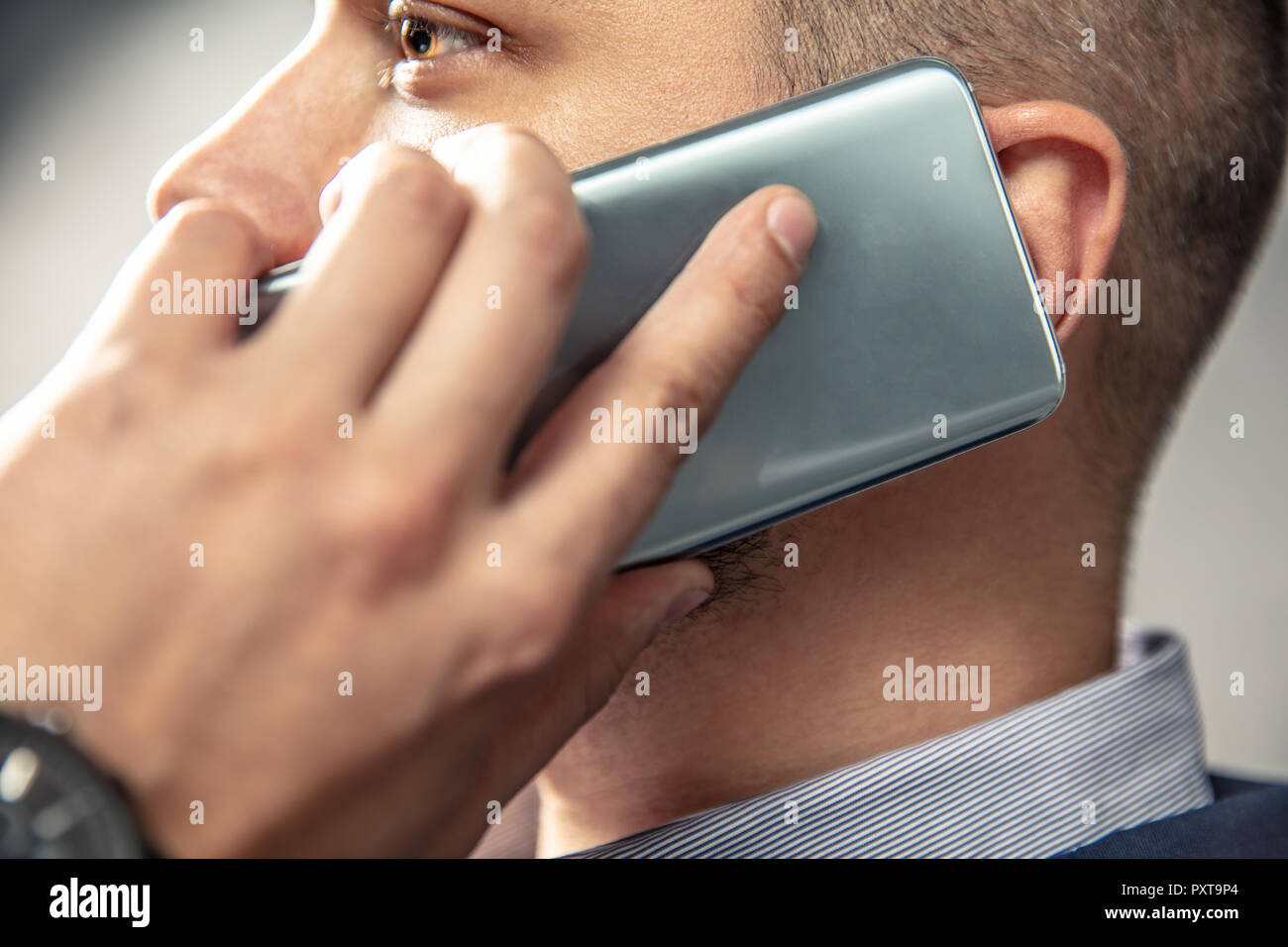 Elegant man is talking on the phone. Horizontal orientation of photo Stock Photo