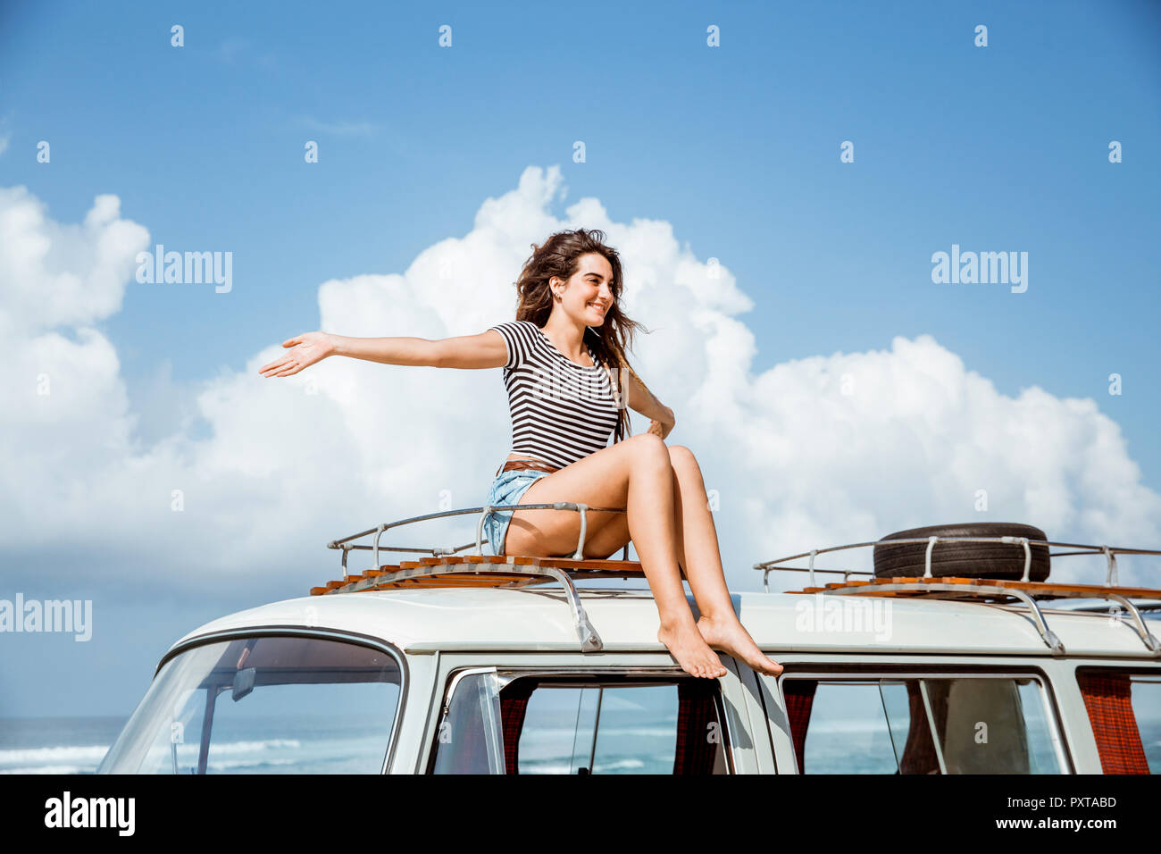 beauty woman raise hands enjoy blow wind on the roof  Stock Photo
