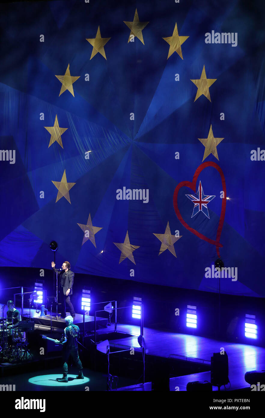 U2 perform in front of a giant EU flag, with one star as the Union Flag, at the o2 Arena in London, during their eXPERIENCE + iNNOCENCE Tour. Stock Photo