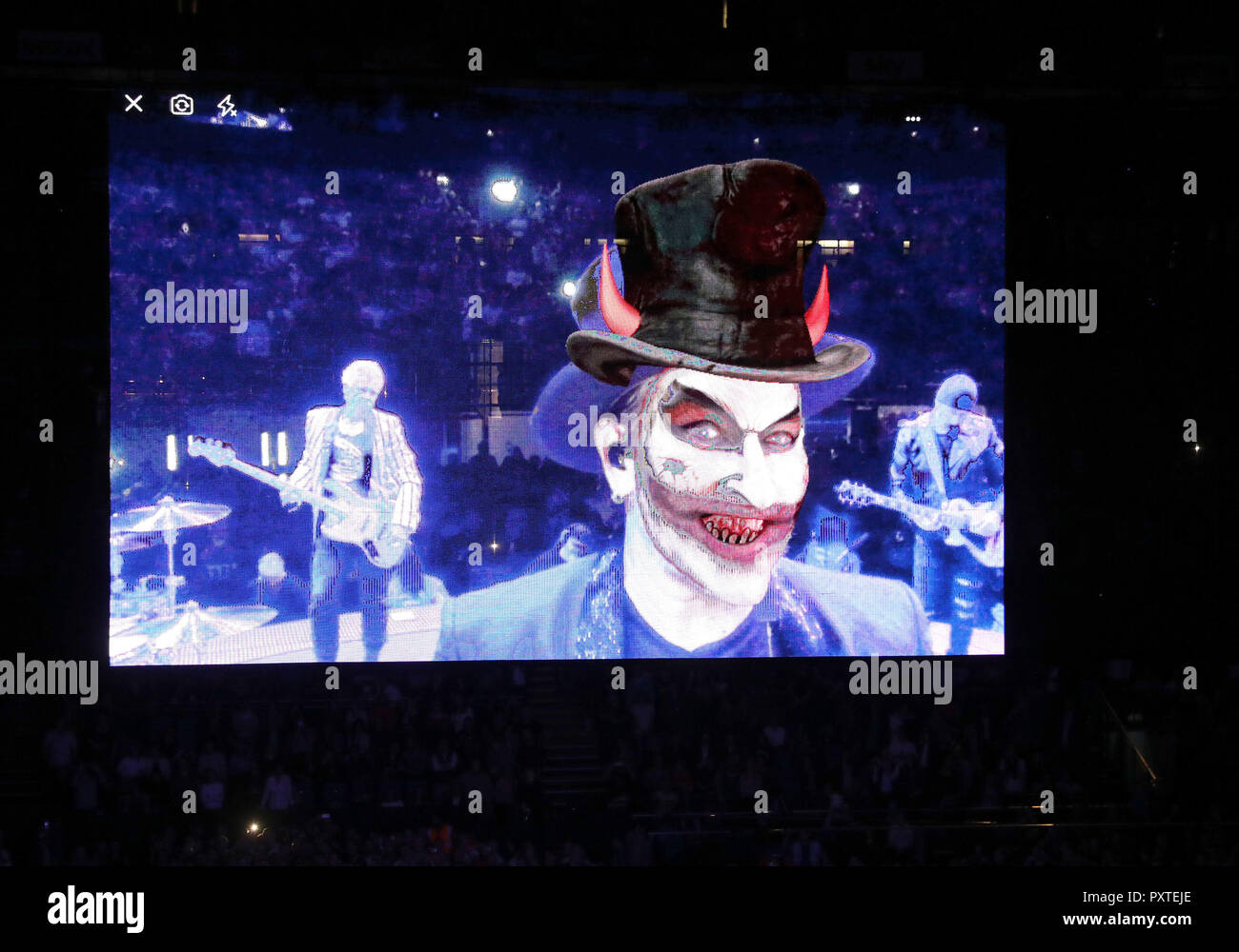 U2's Bono appears as the devil using a snapchat style filter as he performs on stage at the U2 eXPERIENCE + iNNOCENCE Tour. The O2 Arena, London. Stock Photo
