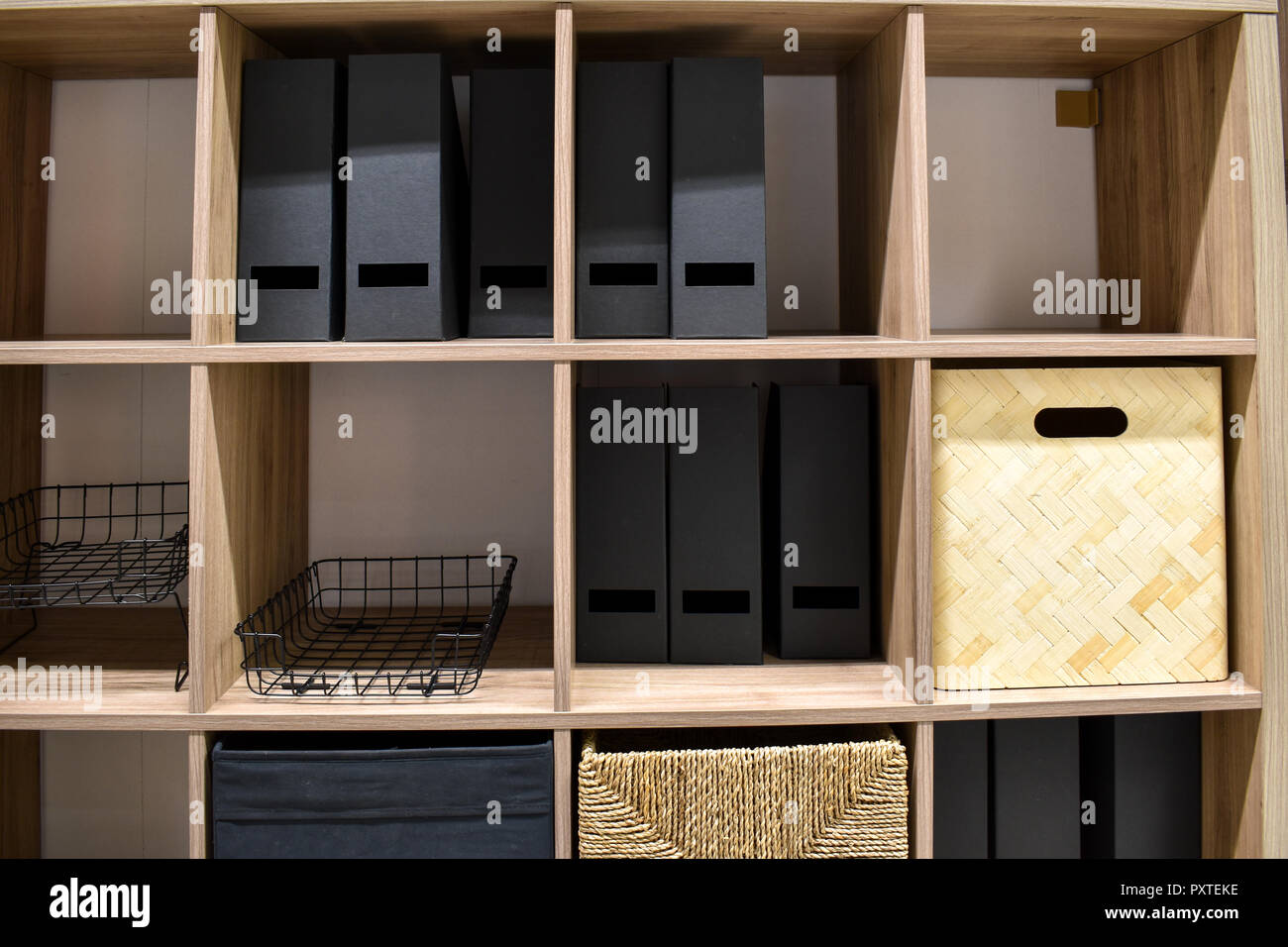 Storage shelves with binders and boxes Stock Photo - Alamy