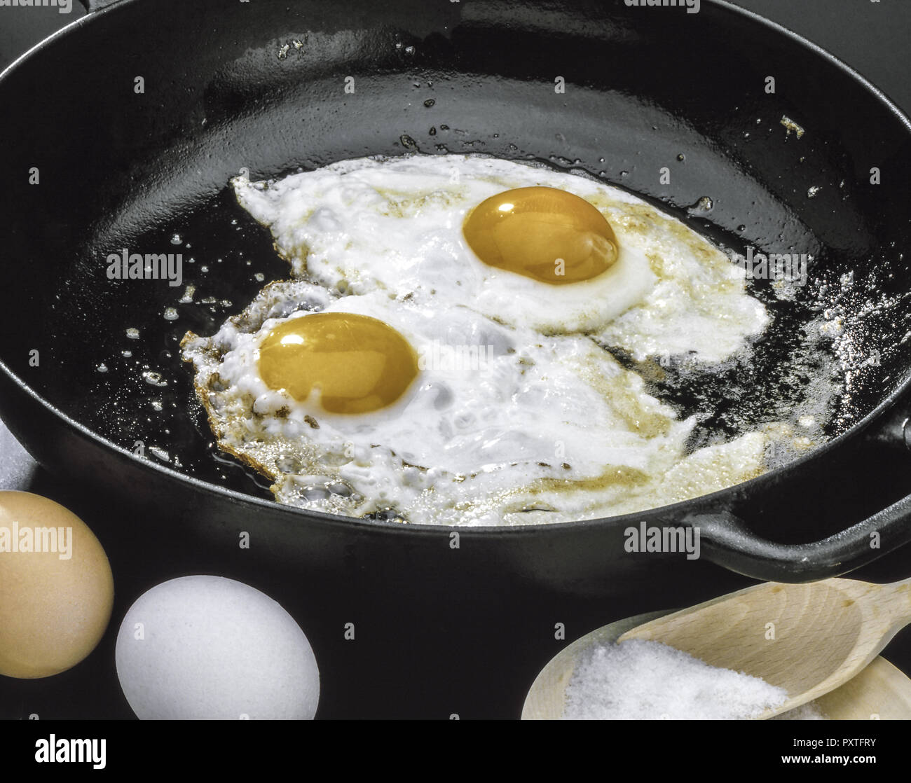 Spiegeleier werden in einer Pfanne gebraten, Fried eggs are fried in a pan, Egg, Eggs, Fried Eggs, Roast, Roasted, Fried, Food, Nutrition, Cooking, Fr Stock Photo