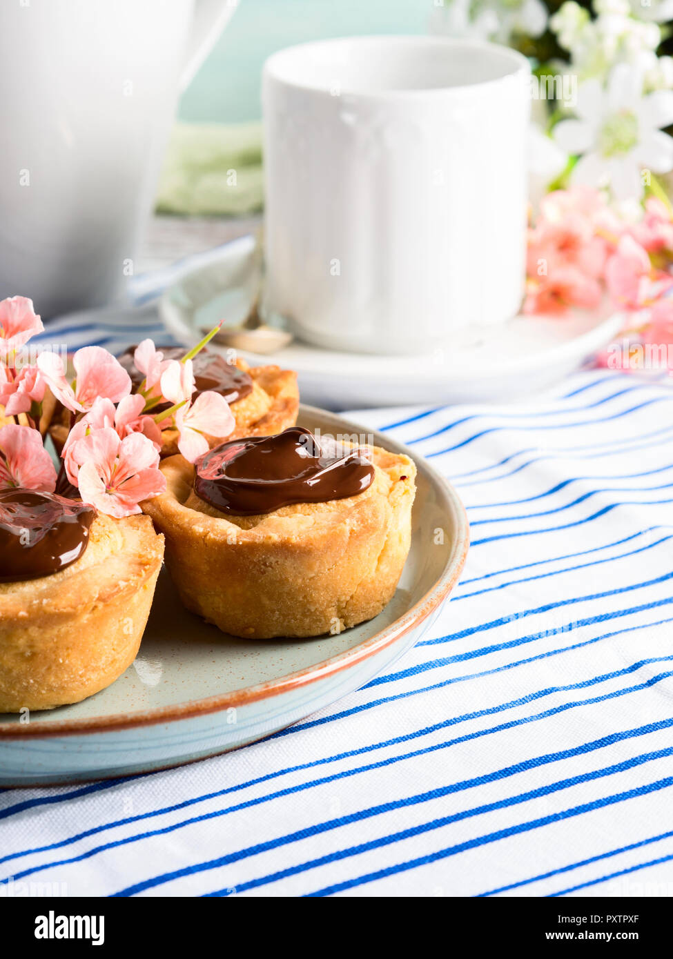Cakes with frangipane, cherry jam and chocolate frosting. Romantic
