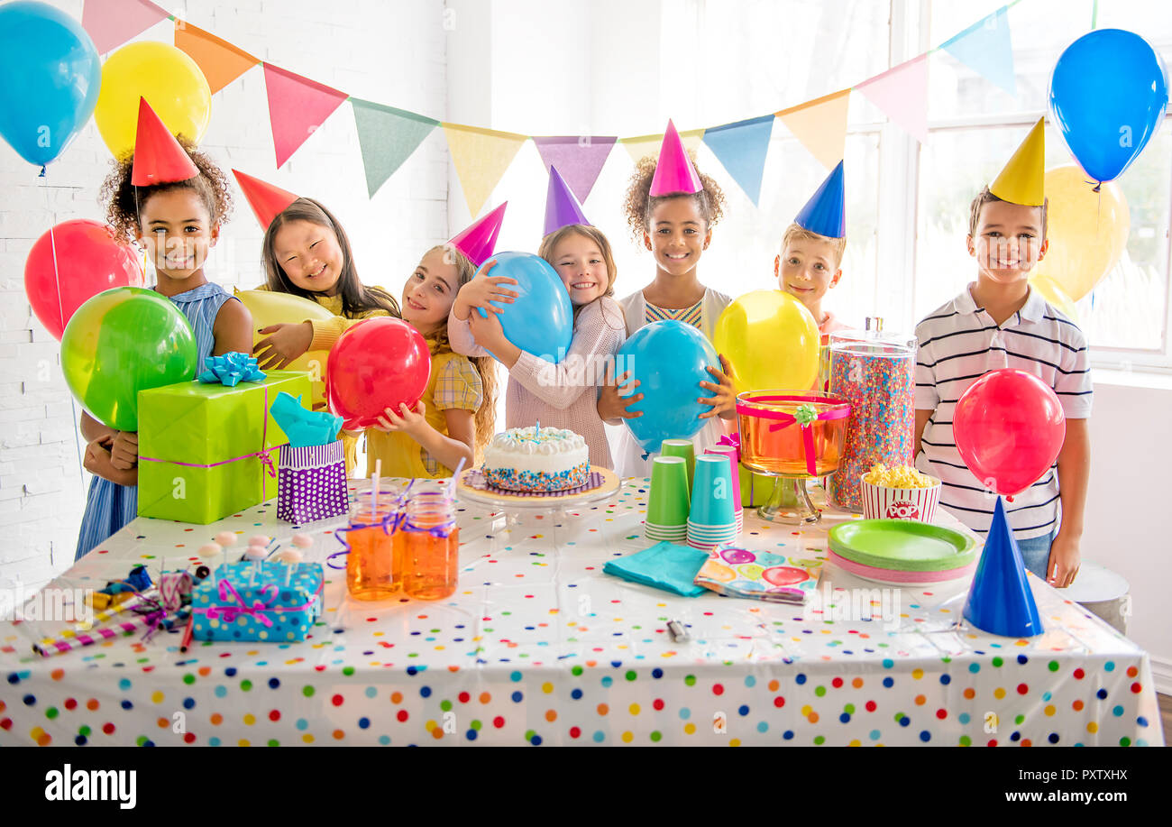 A Group of adorable kids having fun at birthday party Stock Photo