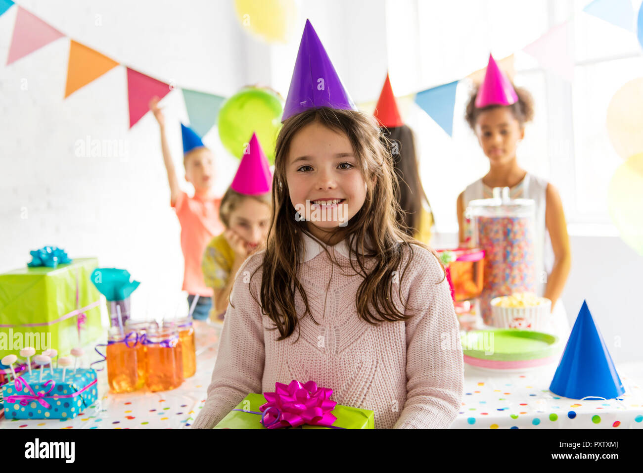 A Group of adorable kids having fun at birthday party Stock Photo